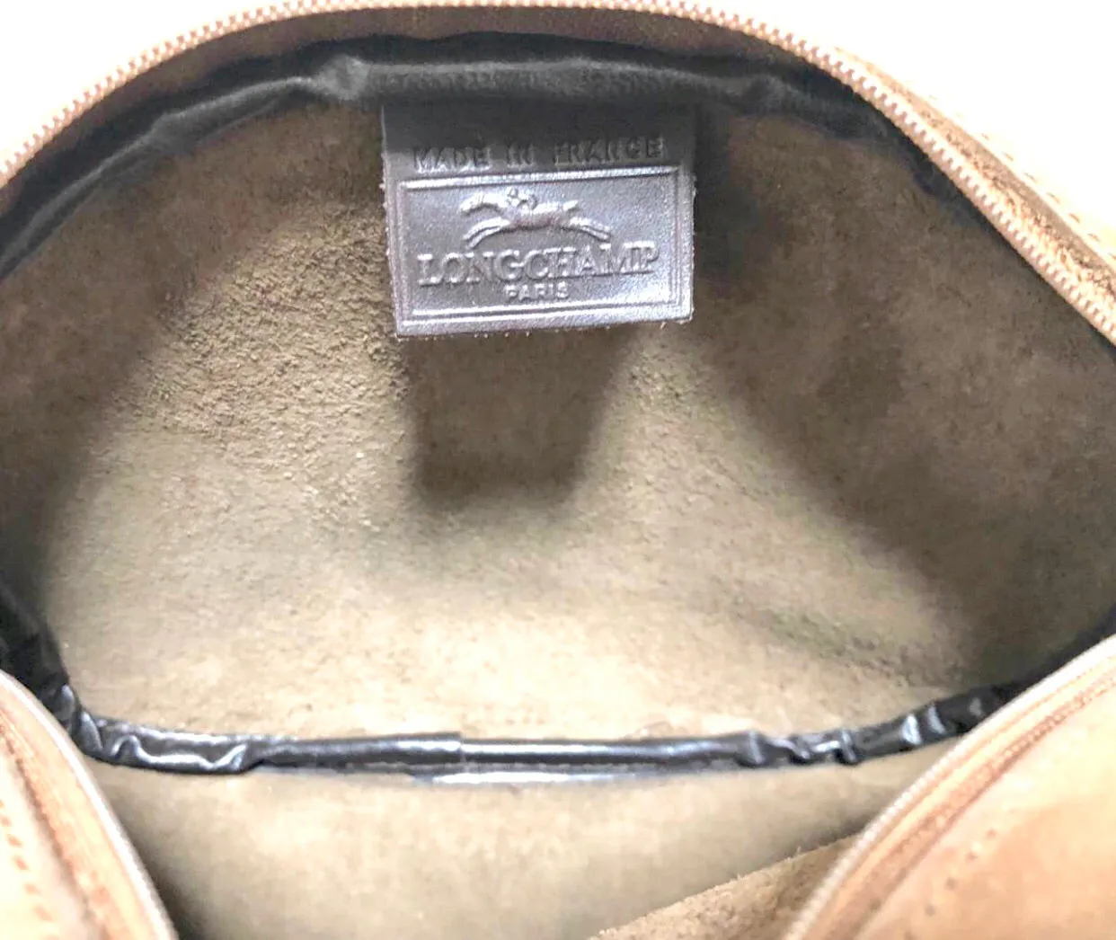 Vintage Longchamp brown suede leather oval round shape shoulder bag with leaf applique motifs. Rare and unique bag back in the okd era.